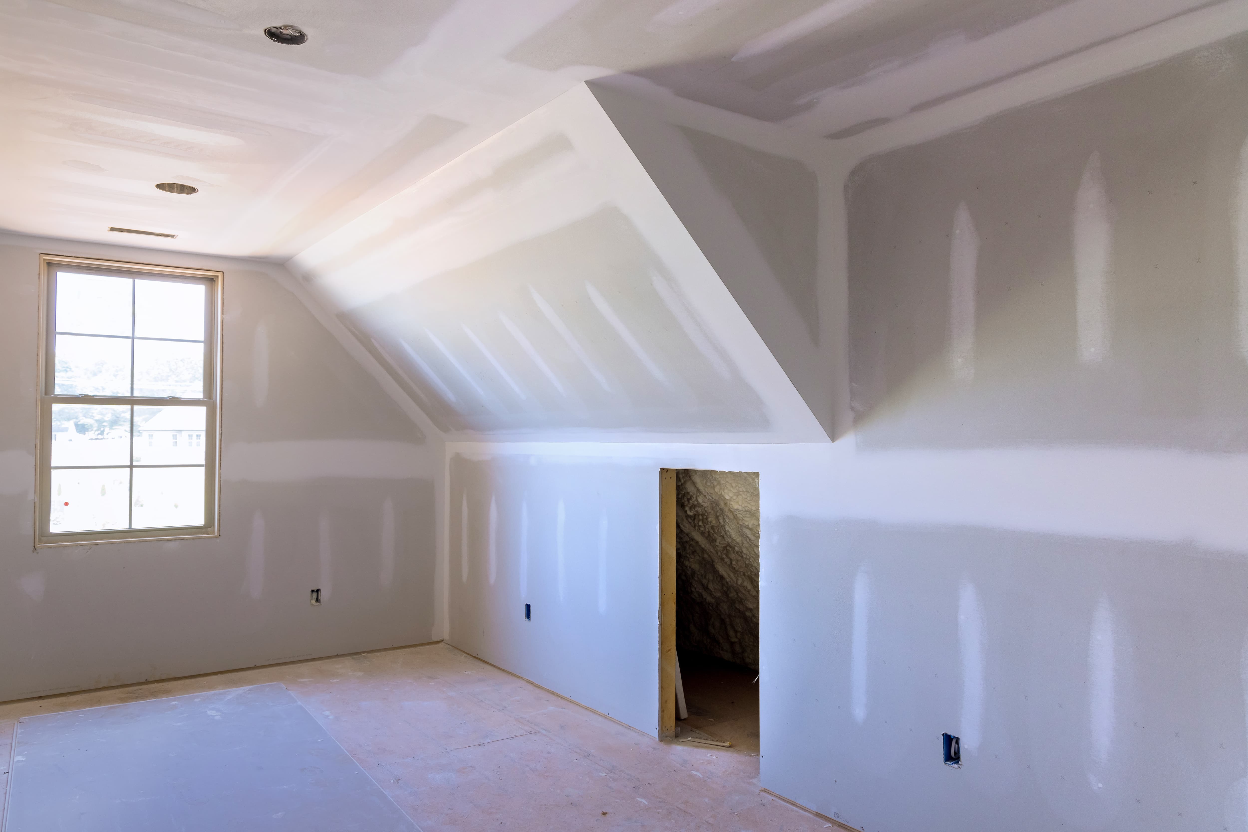 Drywall installation and seamless finishing